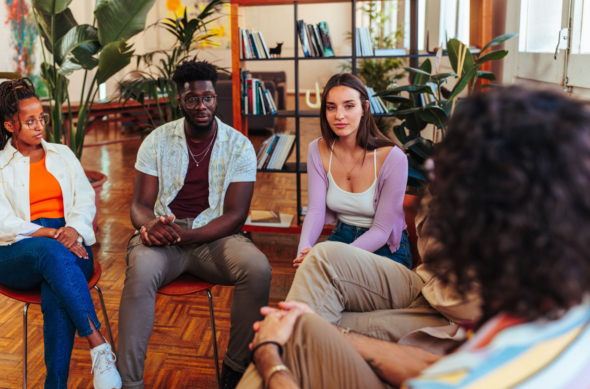 young group of individuals in a therapy setting