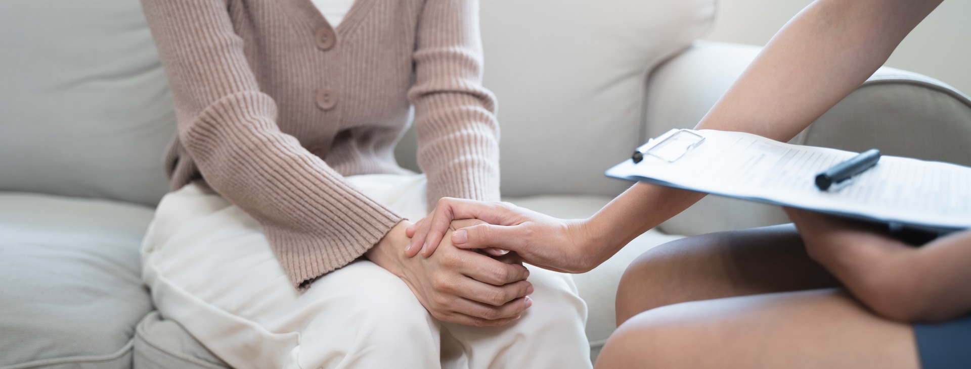 therapist and patient holding hands