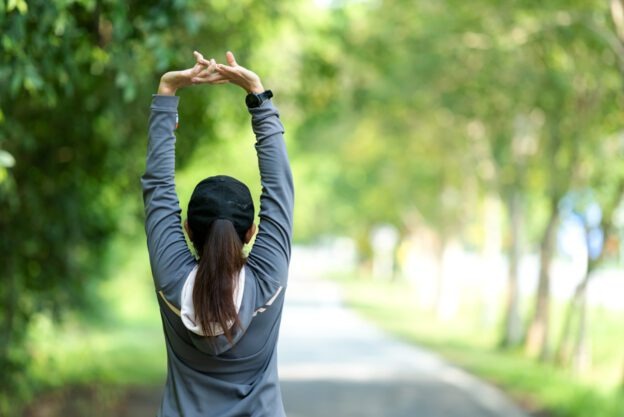 woman stretching outside