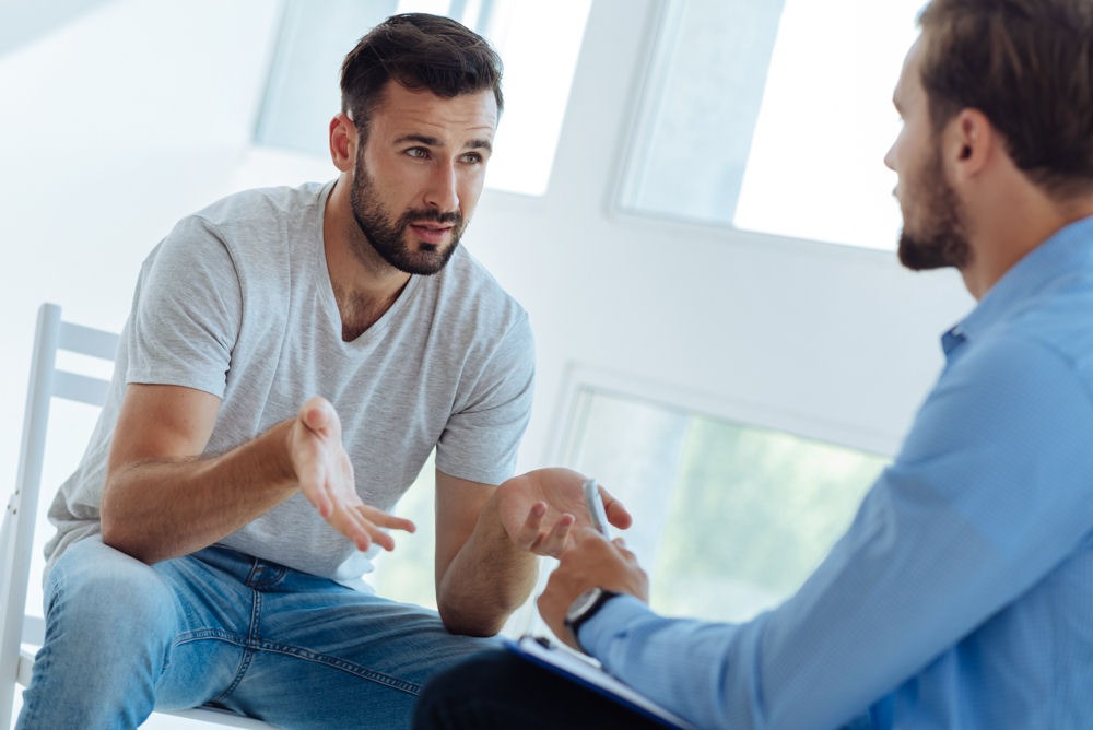 man talking to therapist about stimulant addiction